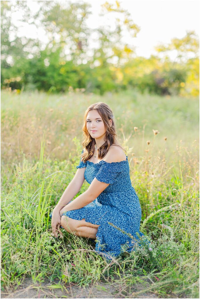 senior session with tall grass at belle isle