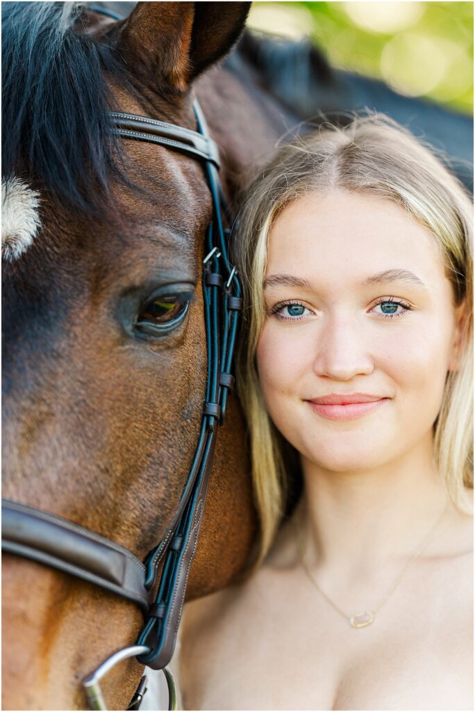 senior pictures with her horse at golden hour on her farm