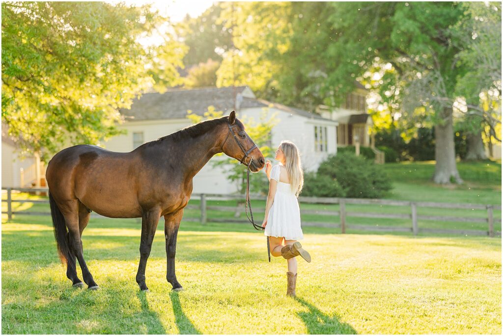 senior pictures with her horse at golden hour on her farm