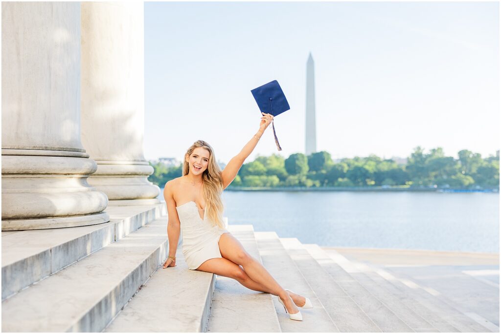 GWU grad pictures on the steps of the Jefferson Memorial