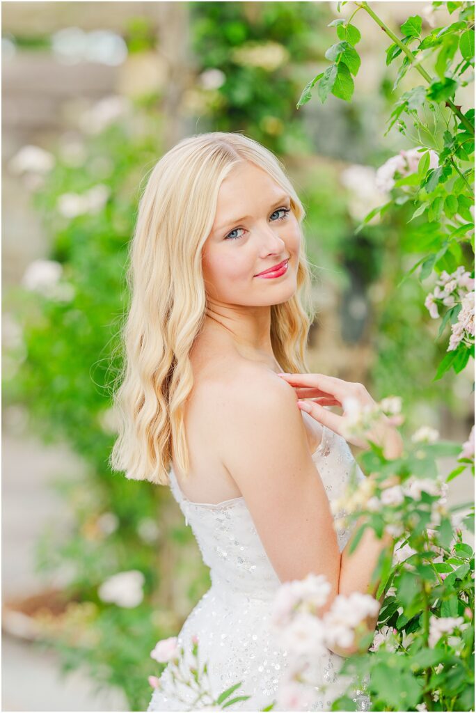 white dress and pink heels for a princess vibe at the rose garden in Lewis Ginter Botanical Gardens for a summer senior session