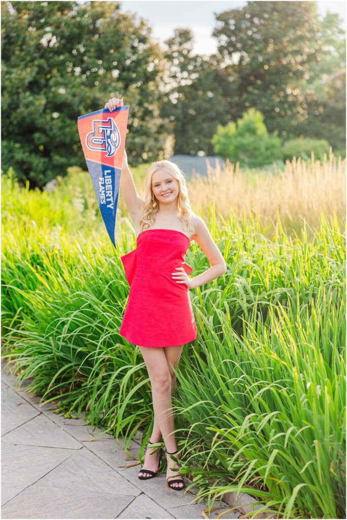 red dress with bow at the conservatory at Lewis Ginter Botanical Gardens for a summer senior session