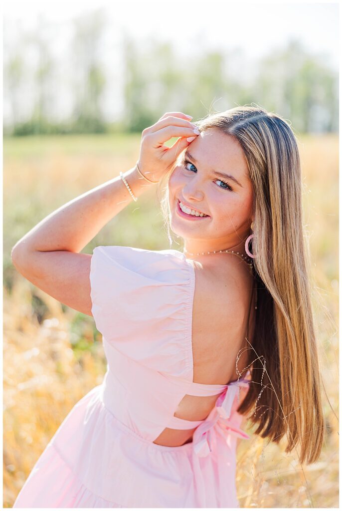 pink dress in the field at the Preserve at Dundee