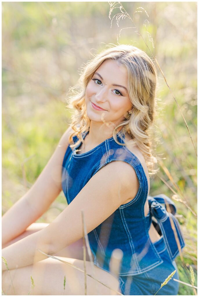 senior pictures at Maymont | denim matching set with an open back and big bow paired with brown cowgirl boots